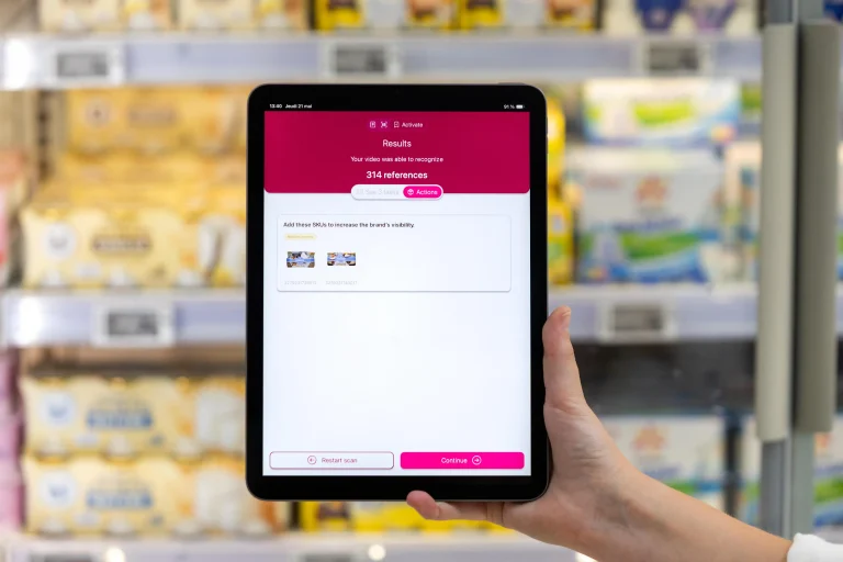 Sales representative viewing AI-generated action recommendations on the EasyPicky mobile app after a shelf audit in a retail store.